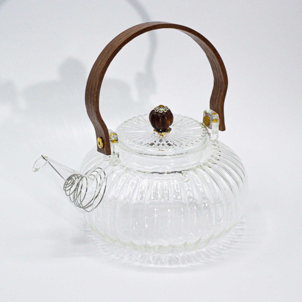 Théière en verre avec infuseur perle nervurée transparente 850 ml, vue de profil, bec à gauche