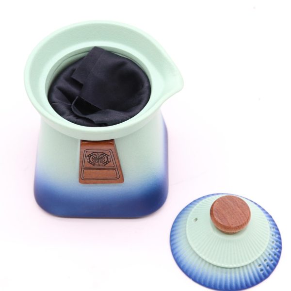 Service à thé trois tasses – bleu, vue de profil, bec à gauche